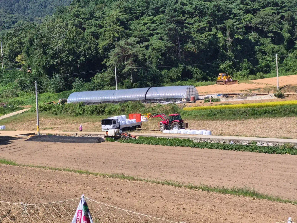 Farm tractor, truck and agricultural work during the busy autumn season in rural Korea