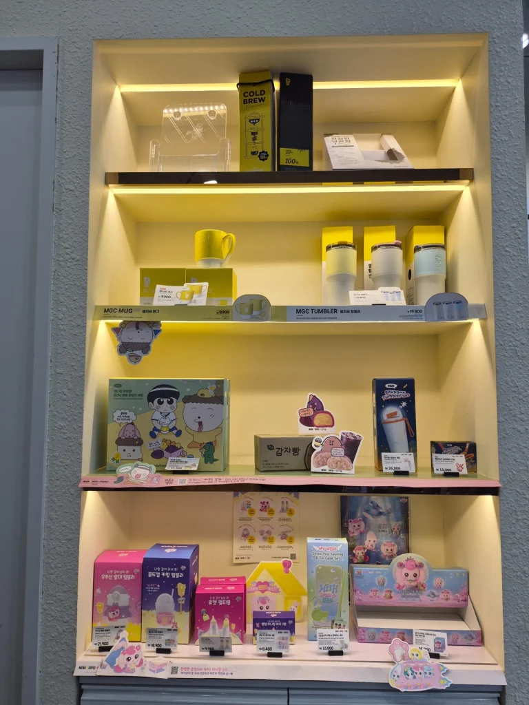 Merchandise and character products displayed inside a Korean franchise cafe