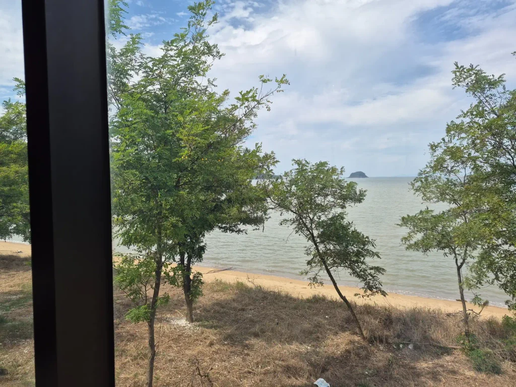 Sea view through a cafe window along Baeksu Coastal Road in Yeonggwang
