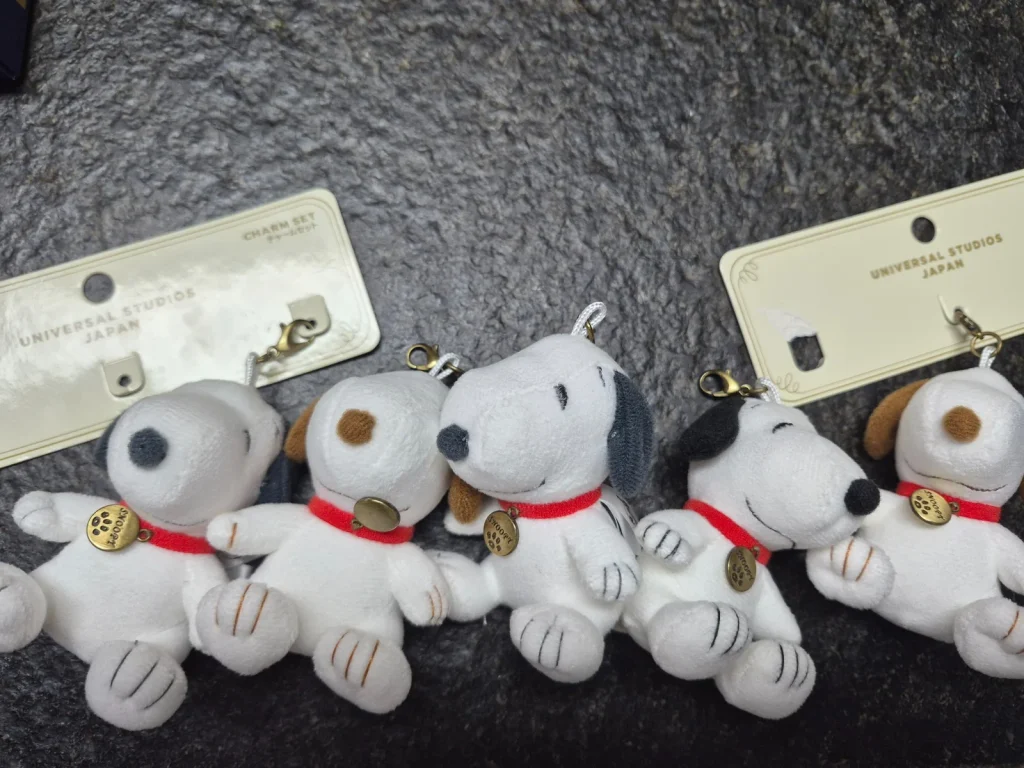 Matching Snoopy plush charms brought home from Japan