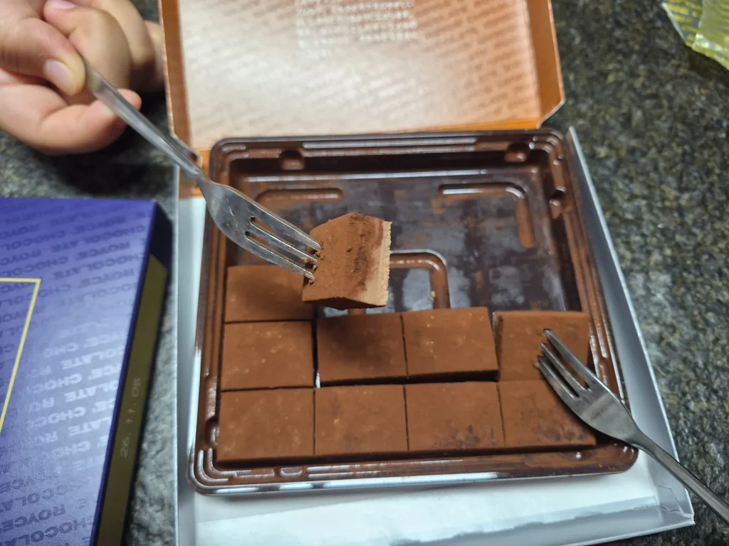 Soft ROYCE nama chocolate being picked up with a small fork